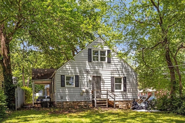 6701 Walrond Ave, Kansas City, MO 64132 - back of property featuring a yard and entry steps