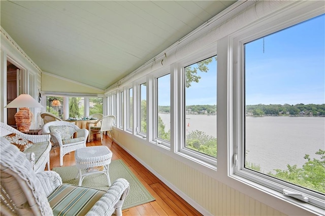 3 M St, Lake Lotawana, MO 64086 - sunroom featuring hardwood / wood-style floors, healthy amount of natural light, a water view, vaulted ceiling, and ornamental molding
