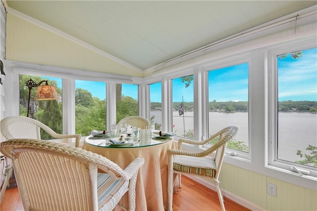 3 M St, Lake Lotawana, MO 64086 - sunroom with vaulted ceiling, healthy amount of natural light, ornamental molding, a water view, and wood finished floors