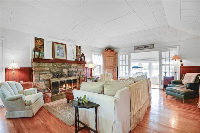 3 M St, Lake Lotawana, MO 64086 - living area with light wood-style flooring and a stone fireplace