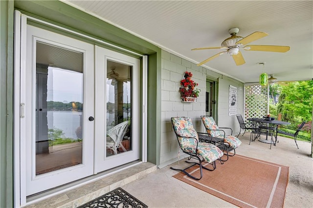 3 M St, Lake Lotawana, MO 64086 - porch with french doors, a ceiling fan, and outdoor dining area