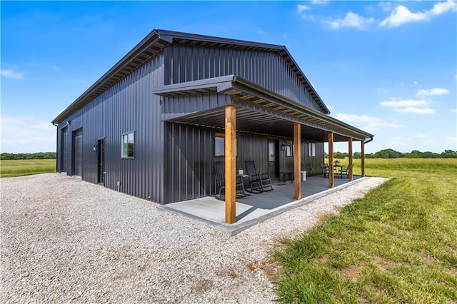 1372 N 150th Rd, Baldwin City, KS 66006 - view of side of property with a patio and a lawn