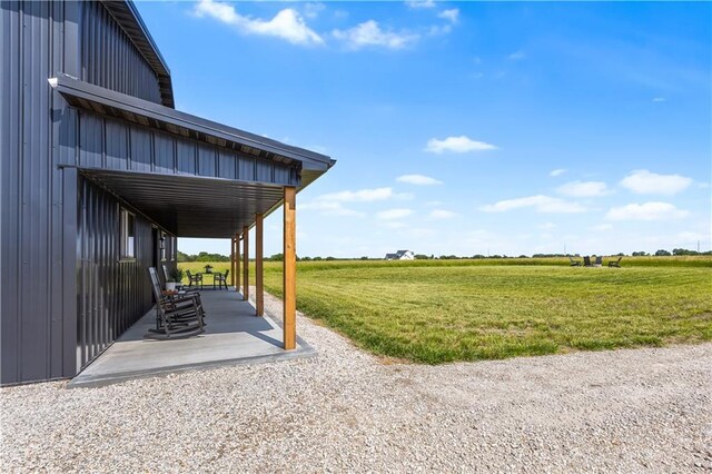 1372 N 150th Rd, Baldwin City, KS 66006 - view of grassy yard with a view of countryside, a carport, and a patio