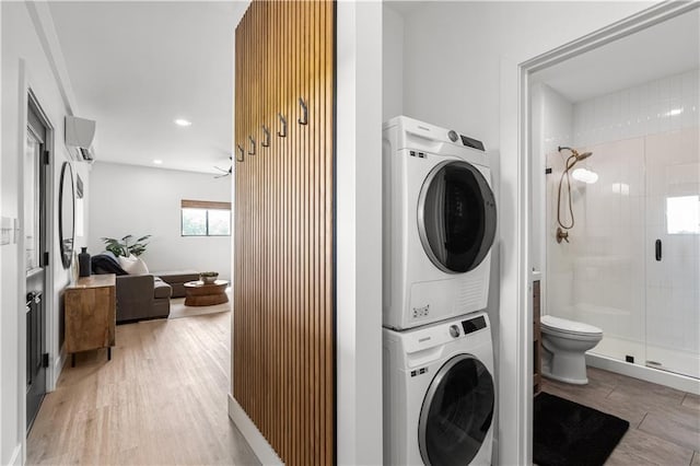 1372 N 150th Rd, Baldwin City, KS 66006 - washroom with stacked washer and clothes dryer, a wall mounted air conditioner, light wood-style floors, and recessed lighting