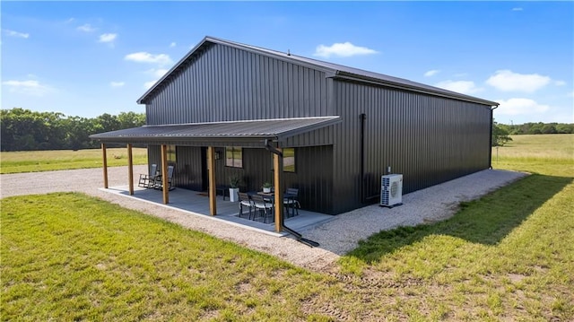 1372 N 150th Rd, Baldwin City, KS 66006 - rear view of property featuring a lawn and a patio