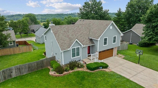 101 Shasta Daisy Dr, Smithville, MO 64089 - traditional home with an attached garage, concrete driveway, and a shingled roof