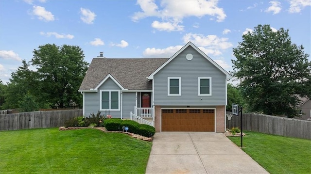 101 Shasta Daisy Dr, Smithville, MO 64089 - split level home featuring an attached garage, concrete driveway, and roof with shingles