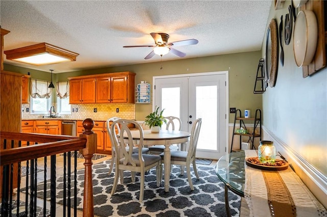 101 Shasta Daisy Dr, Smithville, MO 64089 - dining area with a ceiling fan, french doors, and a textured ceiling