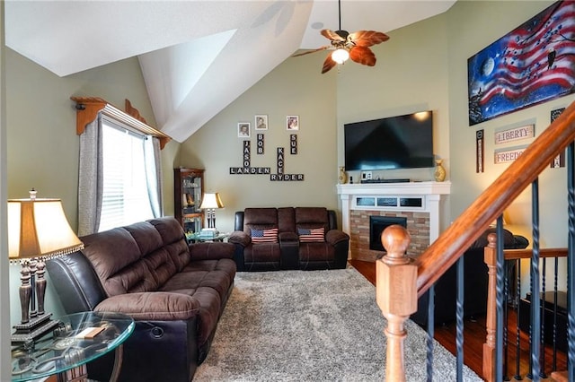 101 Shasta Daisy Dr, Smithville, MO 64089 - living area with a fireplace, ceiling fan, vaulted ceiling, and stairs
