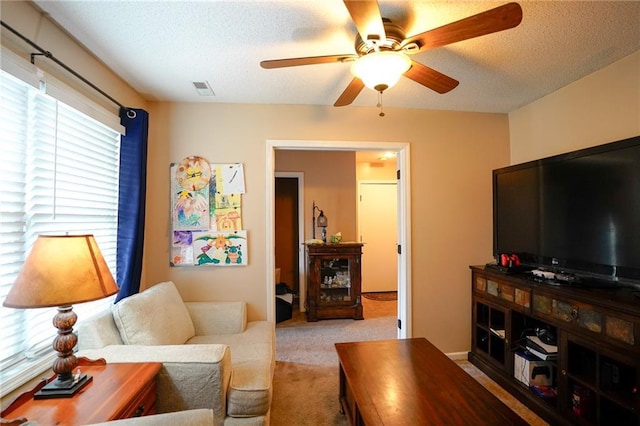 101 Shasta Daisy Dr, Smithville, MO 64089 - carpeted living area featuring a ceiling fan and a textured ceiling