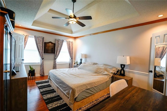 101 Shasta Daisy Dr, Smithville, MO 64089 - bedroom with a tray ceiling, wood finished floors, ornamental molding, a ceiling fan, and recessed lighting
