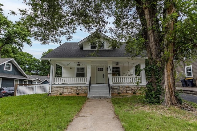 826 W 75th St, Kansas City, MO 64114 - bungalow-style house featuring a porch and roof with shingles