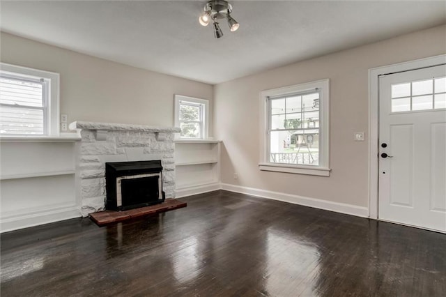 826 W 75th St, Kansas City, MO 64114 - entryway featuring wood finished floors and a fireplace