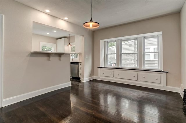 826 W 75th St, Kansas City, MO 64114 - unfurnished living room with plenty of natural light, dark wood-type flooring, and recessed lighting