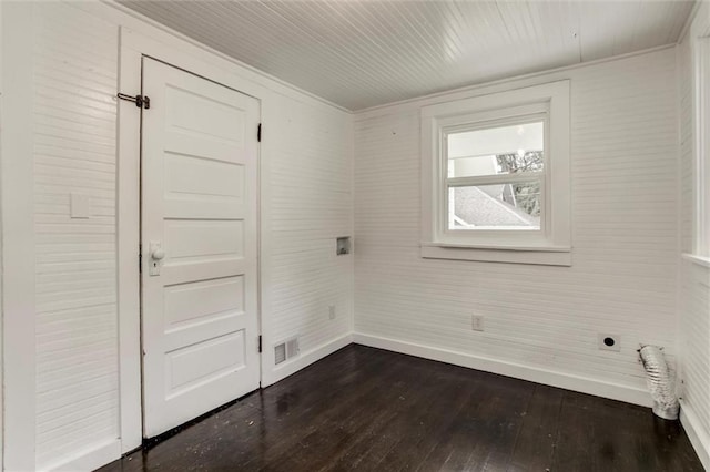 826 W 75th St, Kansas City, MO 64114 - spare room with baseboards and dark wood-type flooring