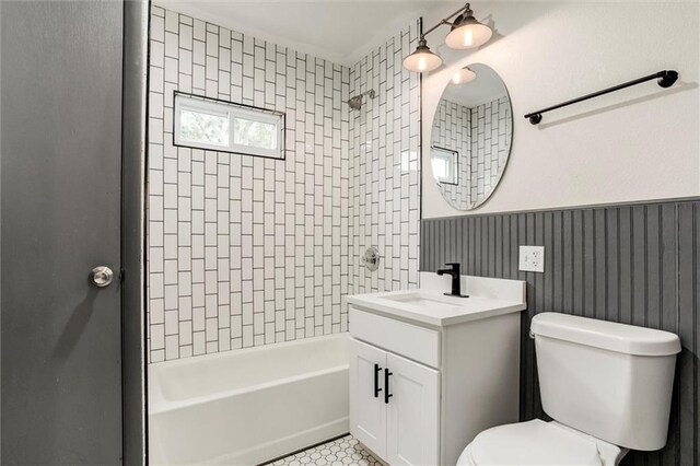 826 W 75th St, Kansas City, MO 64114 - bathroom with vanity,  shower combination, and a wainscoted wall