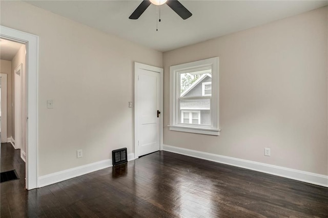 826 W 75th St, Kansas City, MO 64114 - empty room with a ceiling fan and dark wood-type flooring