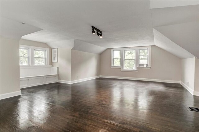 826 W 75th St, Kansas City, MO 64114 - bonus room with dark wood-style flooring, healthy amount of natural light, and lofted ceiling