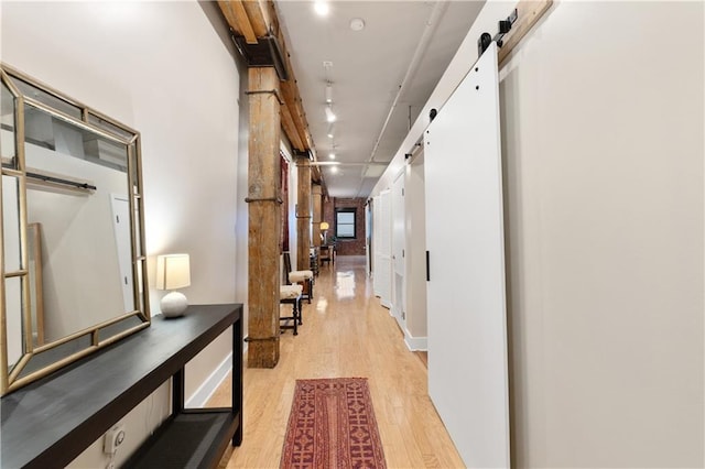 200 Main St Unit 509, Kansas City, MO 64105 - hallway with a barn door and light wood finished floors