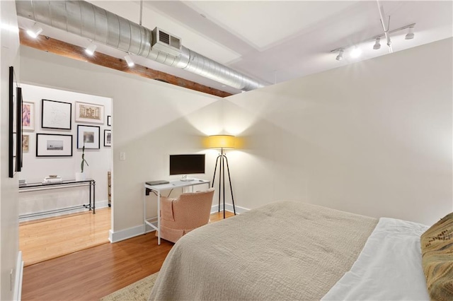 200 Main St Unit 509, Kansas City, MO 64105 - bedroom with rail lighting and wood finished floors