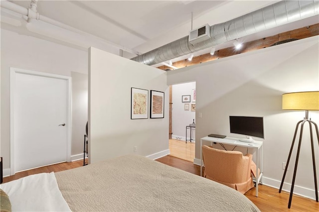 200 Main St Unit 509, Kansas City, MO 64105 - bedroom featuring wood finished floors