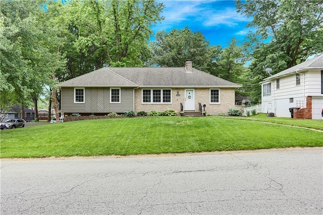 15405 E 43rd Ter, Independence, MO 64055 - ranch-style home with a chimney and a front lawn