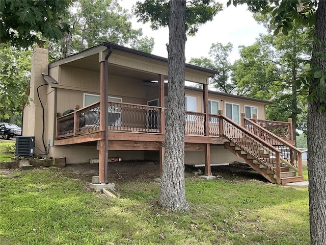 964 Cable Point Dr, Climax Springs, MO 65324 - rear view of property featuring a yard, a wooden deck, stairway, and a chimney