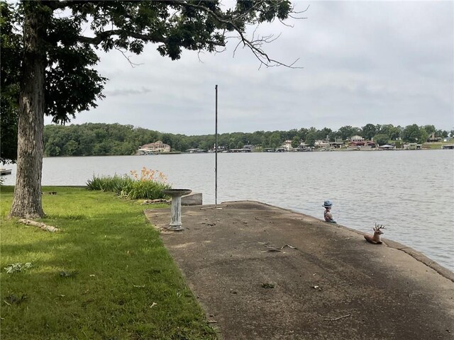 964 Cable Point Dr, Climax Springs, MO 65324 - dock area featuring a water view and a lawn