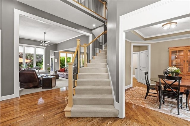 5814 Aminda St, Shawnee, KS 66226 - staircase with crown molding, wood finished floors, and a ceiling fan