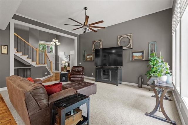 5814 Aminda St, Shawnee, KS 66226 - living room featuring stairs, a ceiling fan, a chandelier, and ornamental molding
