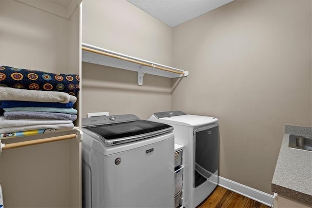 5814 Aminda St, Shawnee, KS 66226 - washroom with separate washer and dryer and dark wood-type flooring
