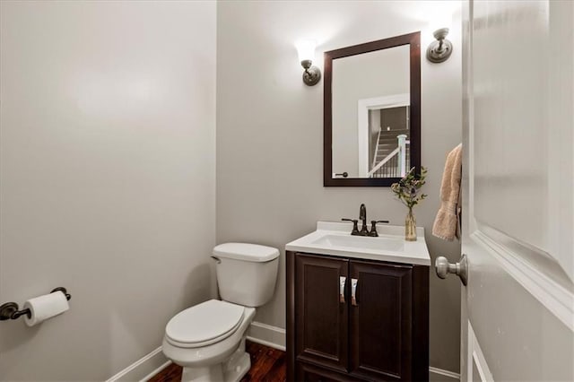 5814 Aminda St, Shawnee, KS 66226 - half bathroom featuring vanity and wood finished floors