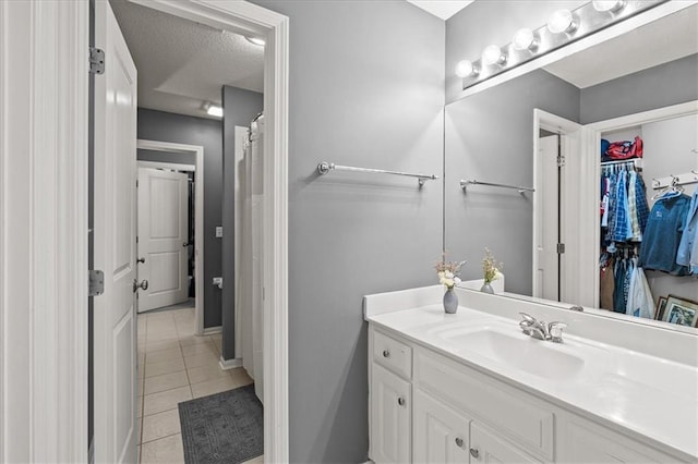 5814 Aminda St, Shawnee, KS 66226 - full bath featuring tile patterned flooring, vanity, and a walk in closet