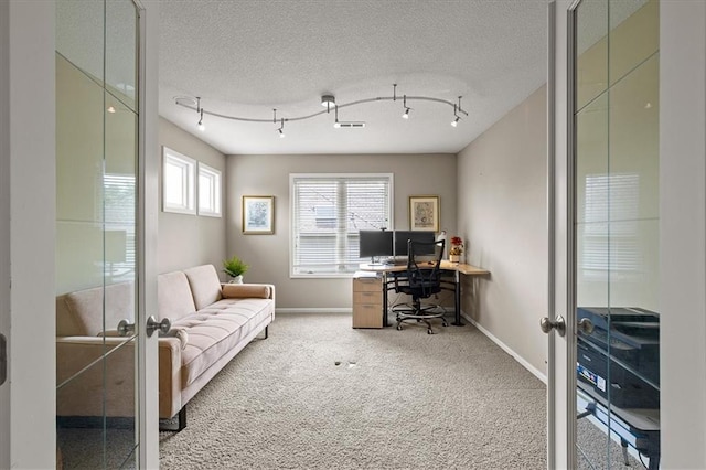 5814 Aminda St, Shawnee, KS 66226 - carpeted home office with french doors and a textured ceiling