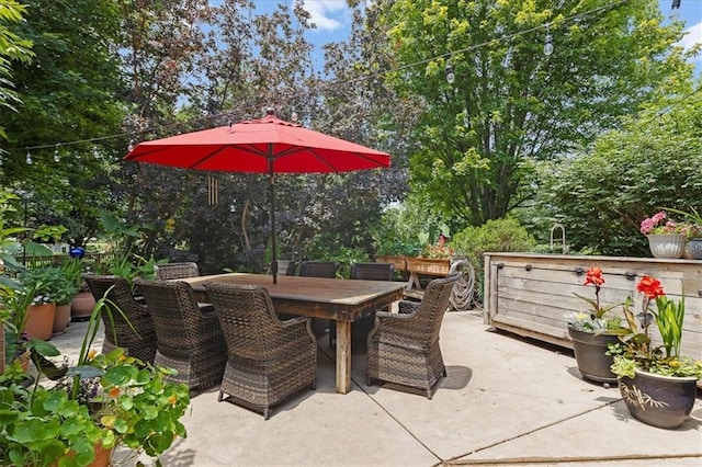 5814 Aminda St, Shawnee, KS 66226 - view of patio featuring outdoor dining area and view of scattered trees