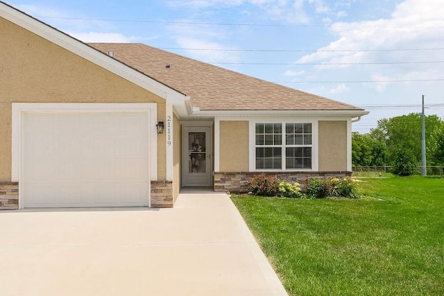 21119 E 8th St S, Independence, MO 64056 - view of front of home featuring stucco siding, concrete driveway, roof with shingles, and stone siding