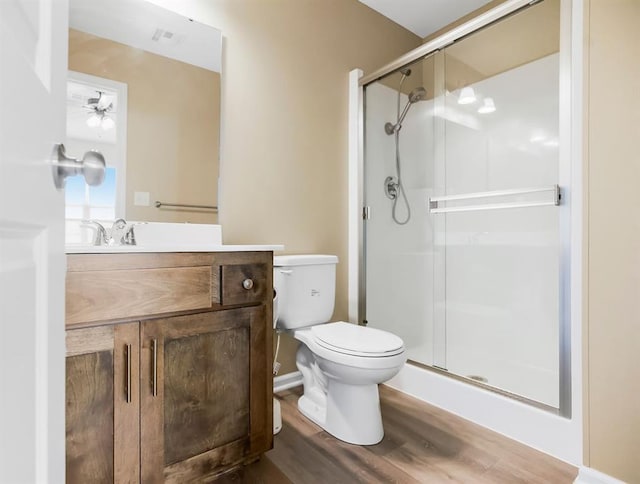 21119 E 8th St S, Independence, MO 64056 - full bath with vanity, a shower stall, wood finished floors, and ceiling fan