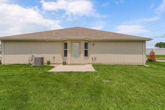21119 E 8th St S, Independence, MO 64056 - rear view of house with a patio area and a lawn
