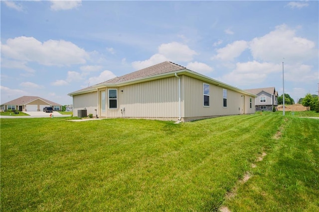 21119 E 8th St S, Independence, MO 64056 - rear view of house featuring a lawn