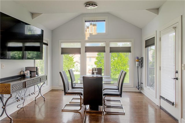 9624 N Arlington Ave, Kansas City, MO 64158 - dining space featuring a chandelier, vaulted ceiling, plenty of natural light, and wood finished floors