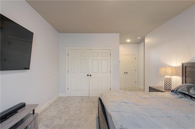 9624 N Arlington Ave, Kansas City, MO 64158 - carpeted bedroom featuring baseboards and multiple closets