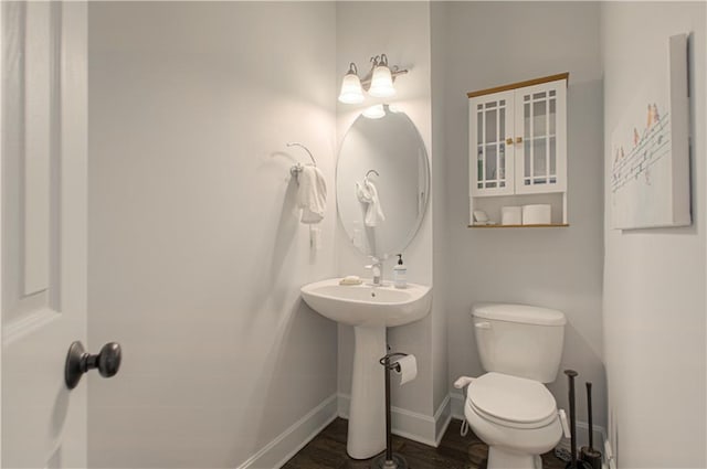 9624 N Arlington Ave, Kansas City, MO 64158 - half bathroom with toilet and wood finished floors