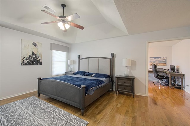 9624 N Arlington Ave, Kansas City, MO 64158 - bedroom with an office area, wood-type flooring, a tray ceiling, and ceiling fan