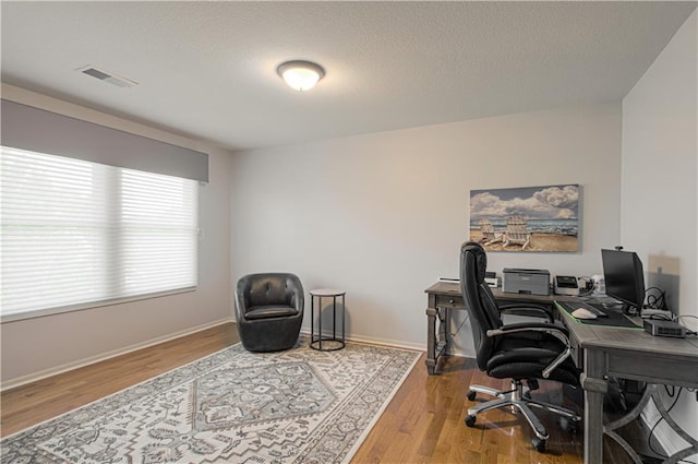 9624 N Arlington Ave, Kansas City, MO 64158 - office with wood finished floors and a textured ceiling