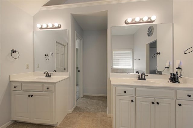 9624 N Arlington Ave, Kansas City, MO 64158 - full bath with two vanities, ornamental molding, and tile patterned flooring