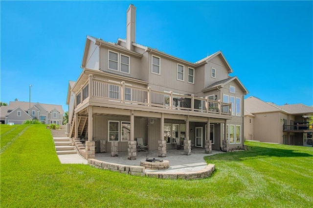 9624 N Arlington Ave, Kansas City, MO 64158 - rear view of property with a patio, a fire pit, a wooden deck, stairway, and a lawn