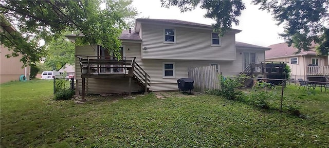1431-33 E Penrose Ln, Olathe, KS 66062 - rear view of house with stairs and a wooden deck