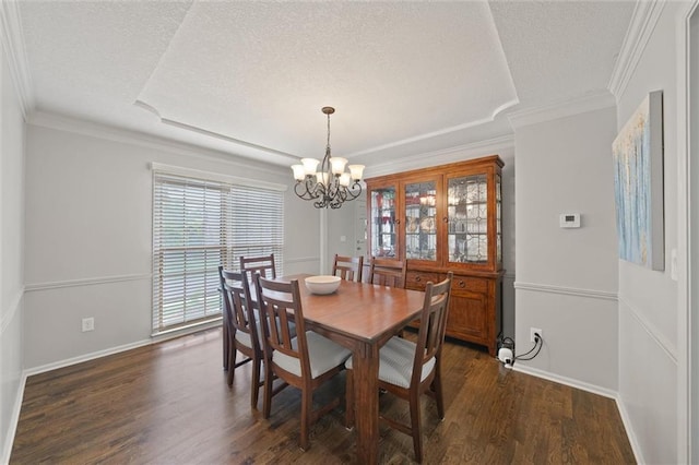 9805 W 121st Ter, Overland Park, KS 66213 - dining space featuring a chandelier, a textured ceiling, dark wood finished floors, and crown molding