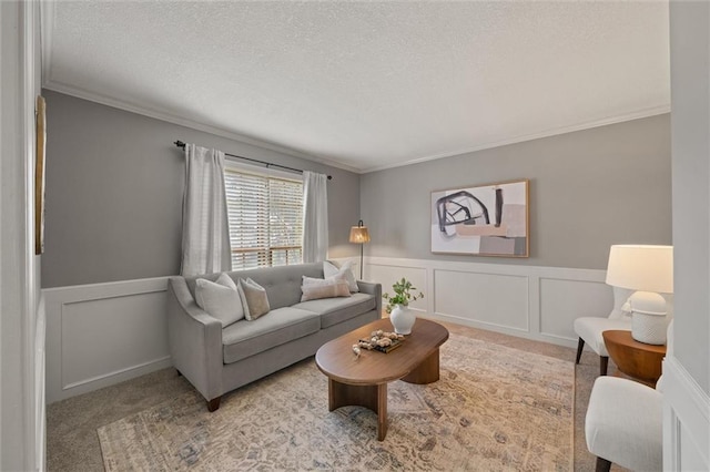 9805 W 121st Ter, Overland Park, KS 66213 - carpeted living area featuring crown molding, wainscoting, a textured ceiling, and a decorative wall
