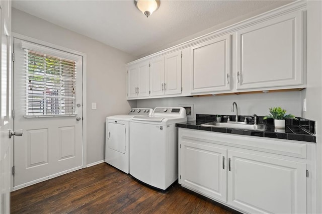 9805 W 121st Ter, Overland Park, KS 66213 - laundry area featuring washing machine and dryer, cabinet space, and dark wood-style floors